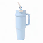 Lineup of black, blue, and green insulated tumblers with matching handles.
