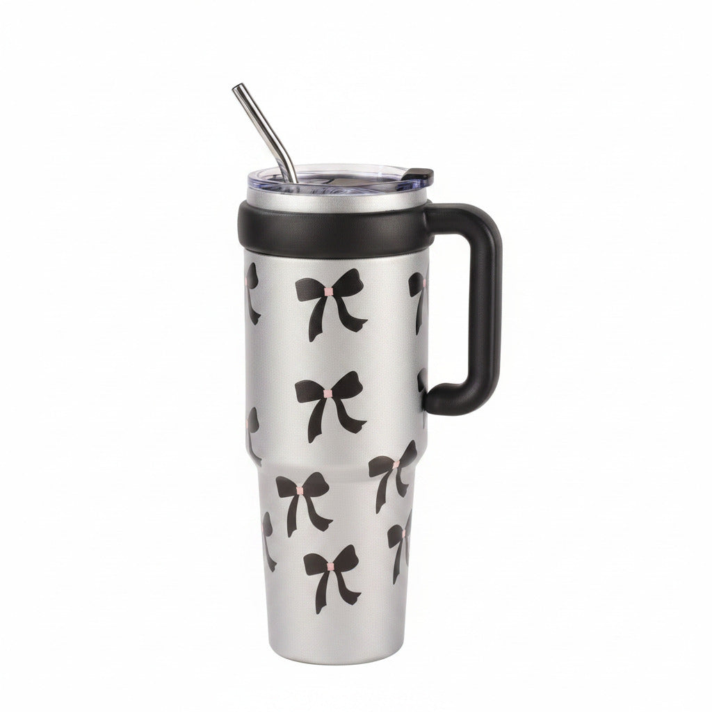 Portable metal water cup highlighting its user-friendly straw lid mechanism.