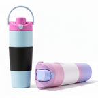 Stainless steel insulated travel mug standing on a plain background.