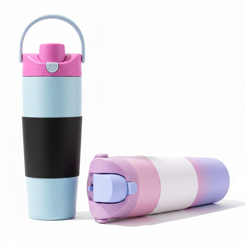Stainless steel insulated travel mug standing on a plain background.