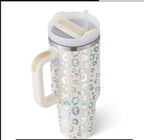 Tapered insulated mug showcasing festive heart and bear graphic patterns.