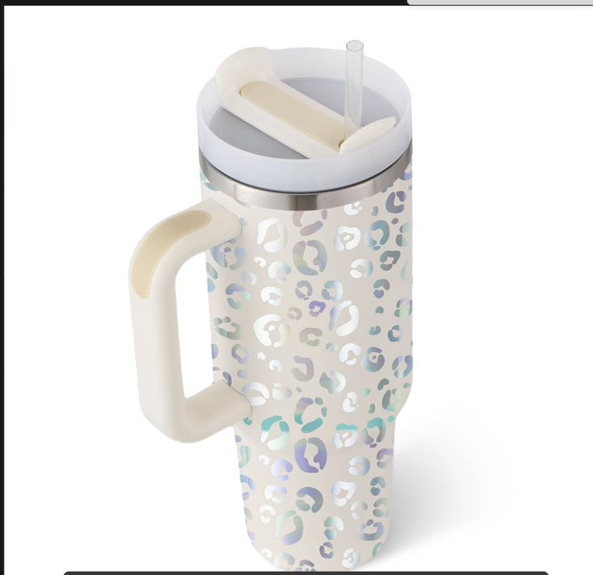 Tapered insulated mug showcasing festive heart and bear graphic patterns.