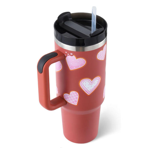 Travel tumbler featuring an ergonomic side handle and a convenient straw lid.
