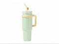 Lineup of black, blue, and green insulated tumblers