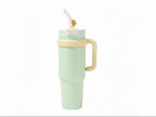 Lineup of black, blue, and green insulated tumblers